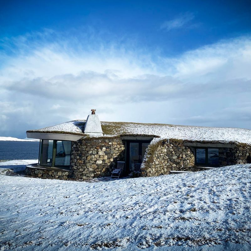 One of Blue Reef Cottages on the Isle of Harris covered in snow